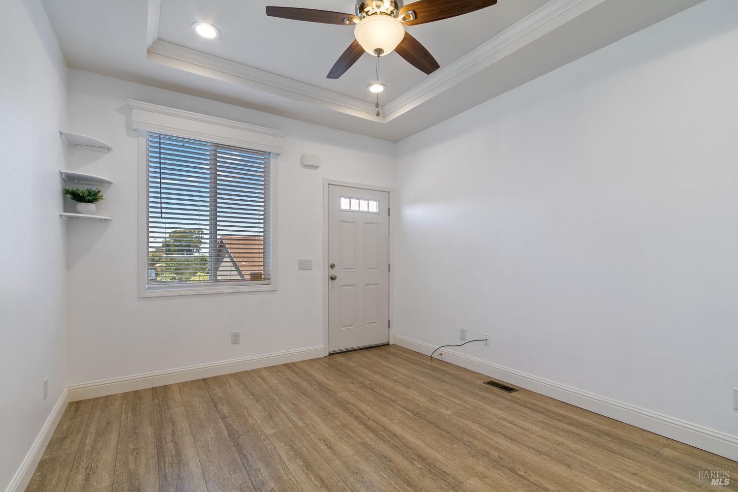 1161 Benicia Road, Unit 18 Vallejo, CA 94591 - Photo 8 of 16 wooden floor in an empty room with a window