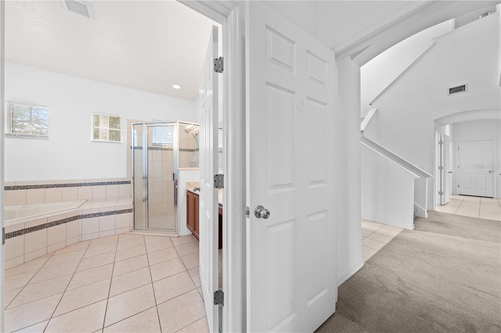3111 Silver Fin Way Kissimmee, FL 34746 - Photo 28 of 50 a view of a hallway with closet and a bathroom