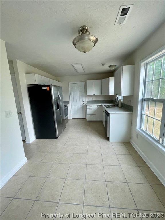 19 Boston Harbor Cameron, NC 28326 - Photo 3 of 18 a large white kitchen with a stove a refrigerator and a sink