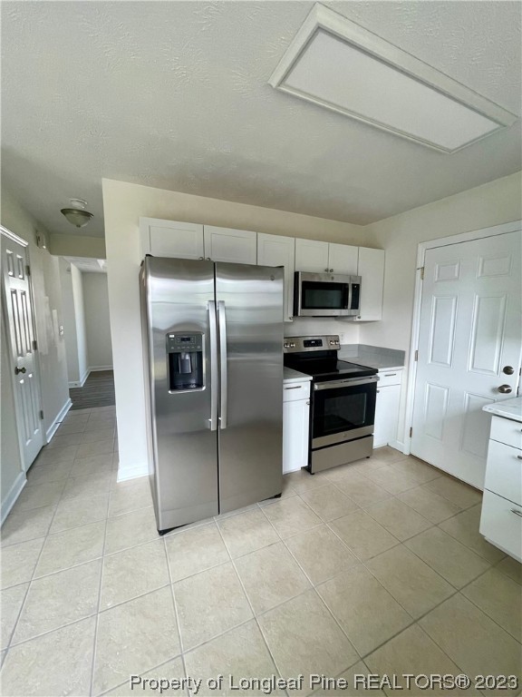 19 Boston Harbor Cameron, NC 28326 - Photo 4 of 18 a kitchen with granite countertop a refrigerator and a sink