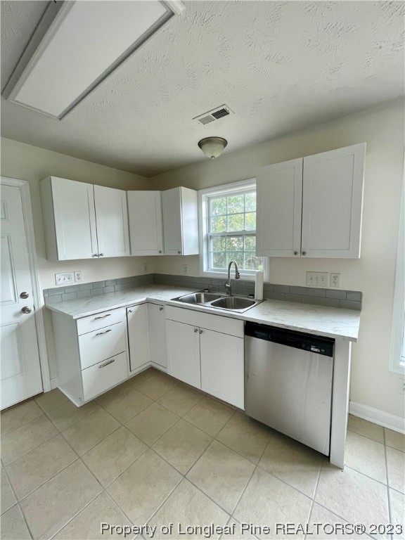 19 Boston Harbor Cameron, NC 28326 - Photo 5 of 18 a kitchen with white cabinets a sink and dishwasher