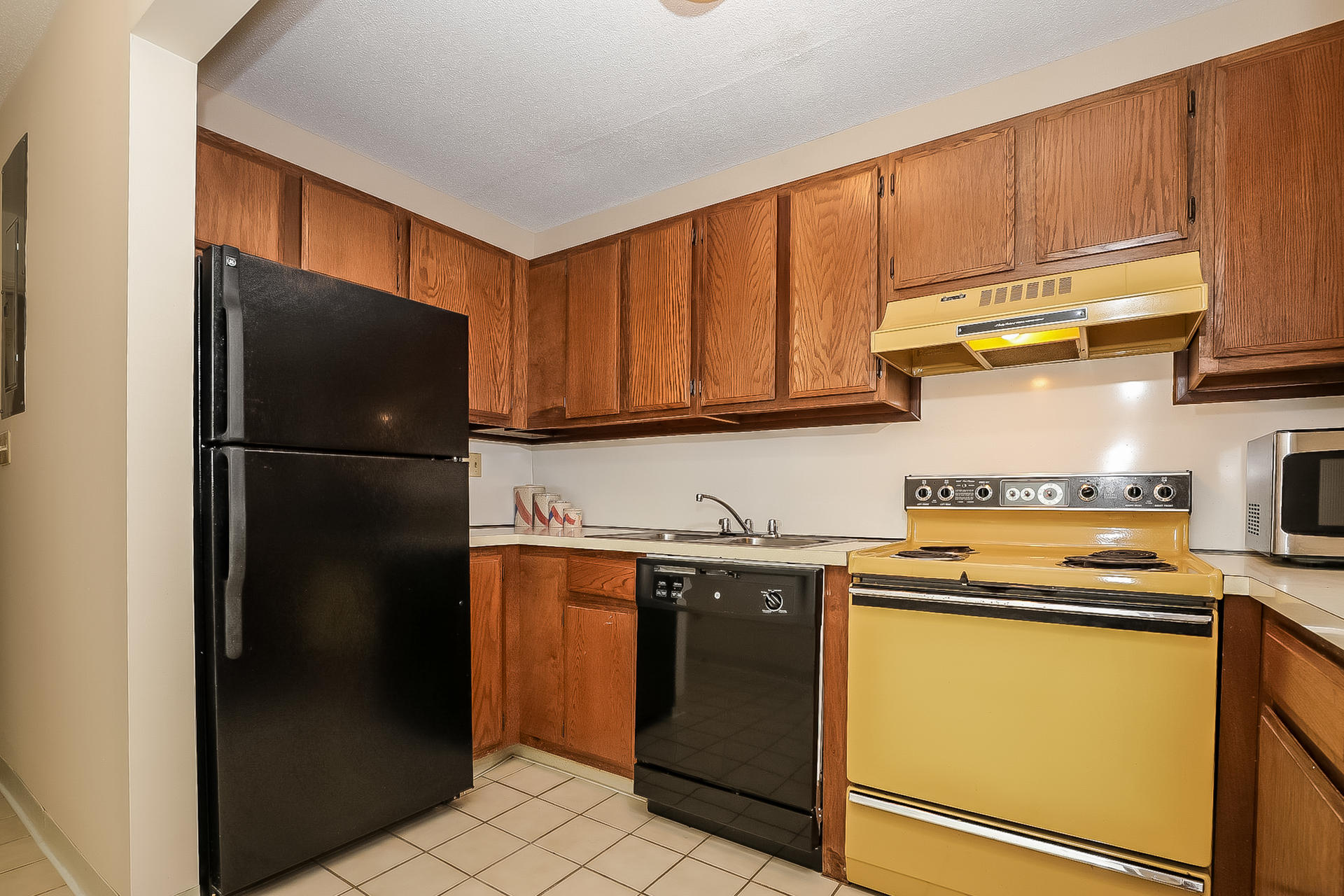 800 Bearses Way, Unit 3EB Hyannis, MA 02601 - Photo 11 of 23 a kitchen with a refrigerator and cabinets