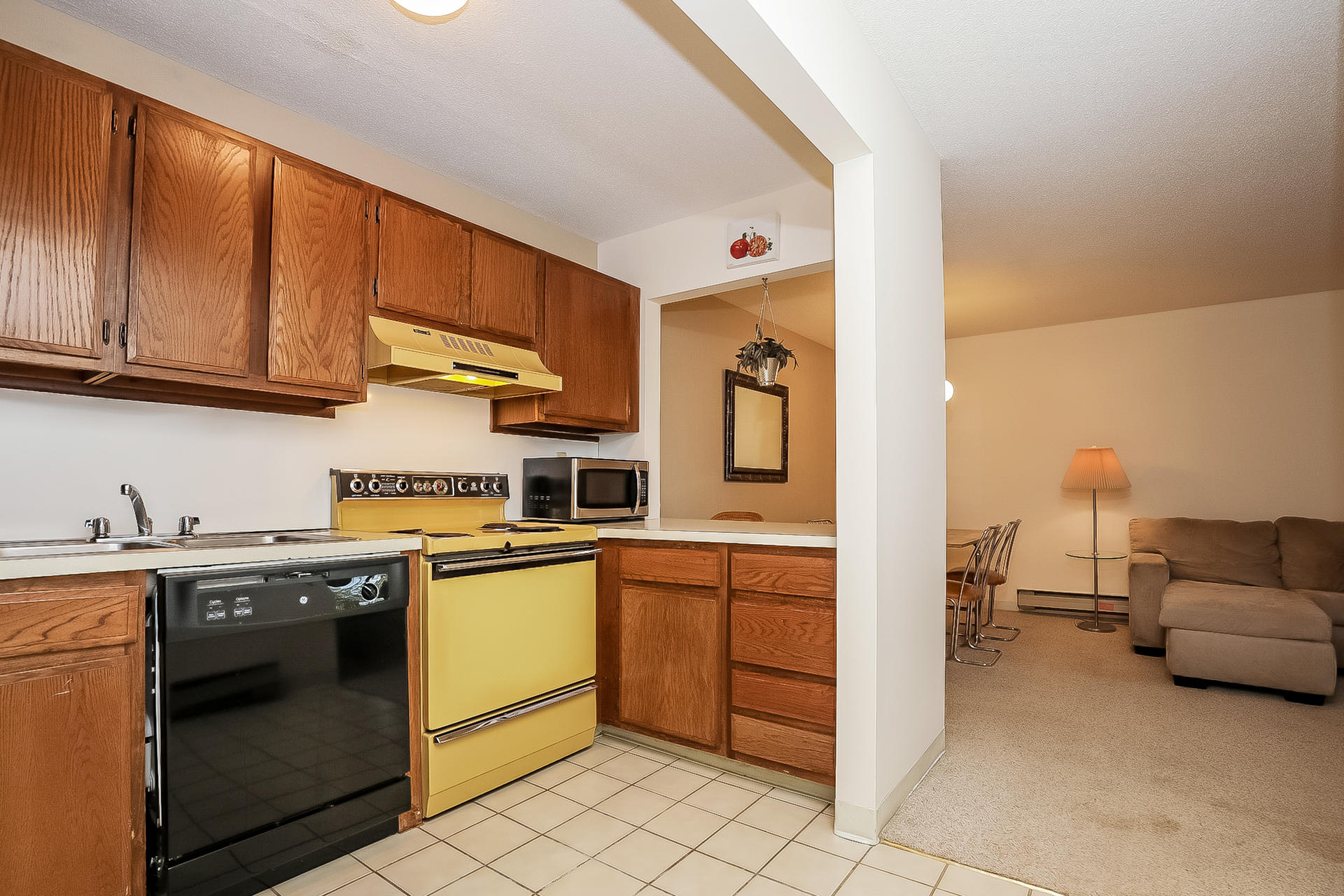 800 Bearses Way, Unit 3EB Hyannis, MA 02601 - Photo 12 of 23 a kitchen with stainless steel appliances granite countertop a sink and cabinets