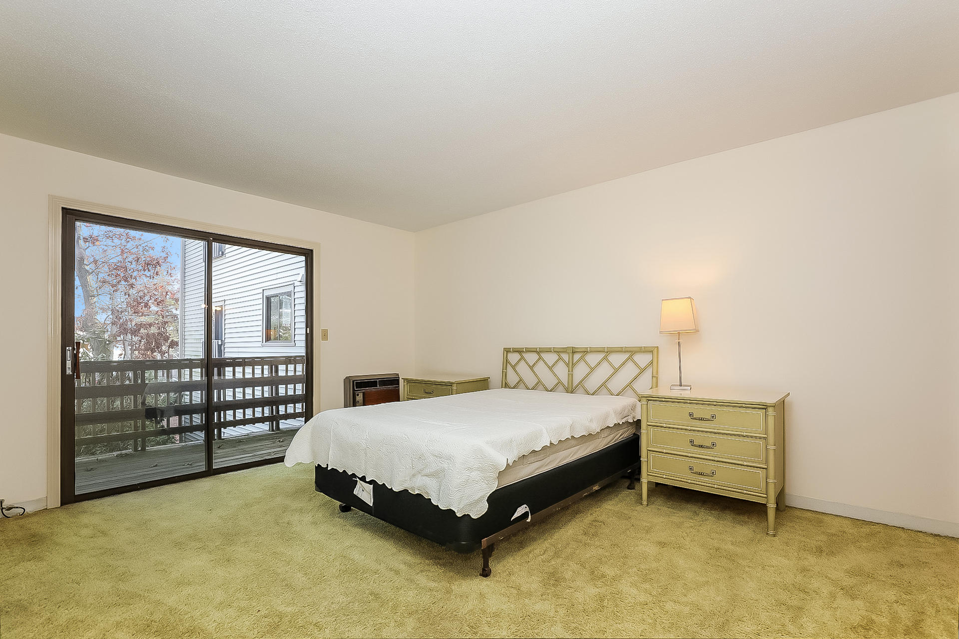 800 Bearses Way, Unit 3EB Hyannis, MA 02601 - Photo 13 of 23 a bedroom with a bed and large window