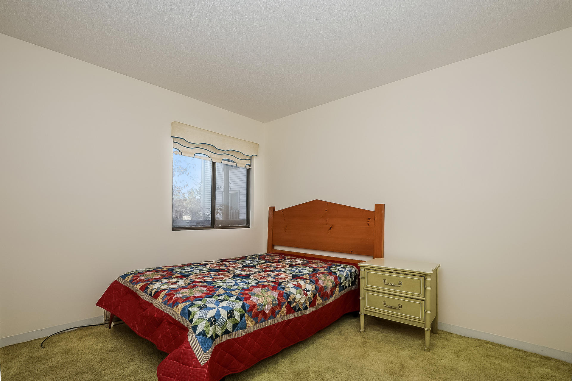 800 Bearses Way, Unit 3EB Hyannis, MA 02601 - Photo 17 of 23 a bedroom with a bed and window