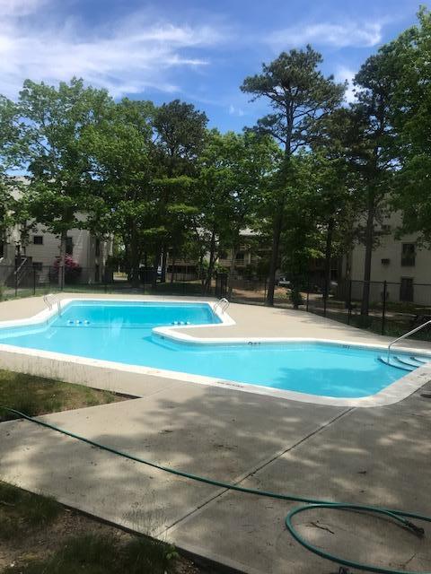 800 Bearses Way, Unit 3EB Hyannis, MA 02601 - Photo 23 of 23 a view of a swimming pool with a yard