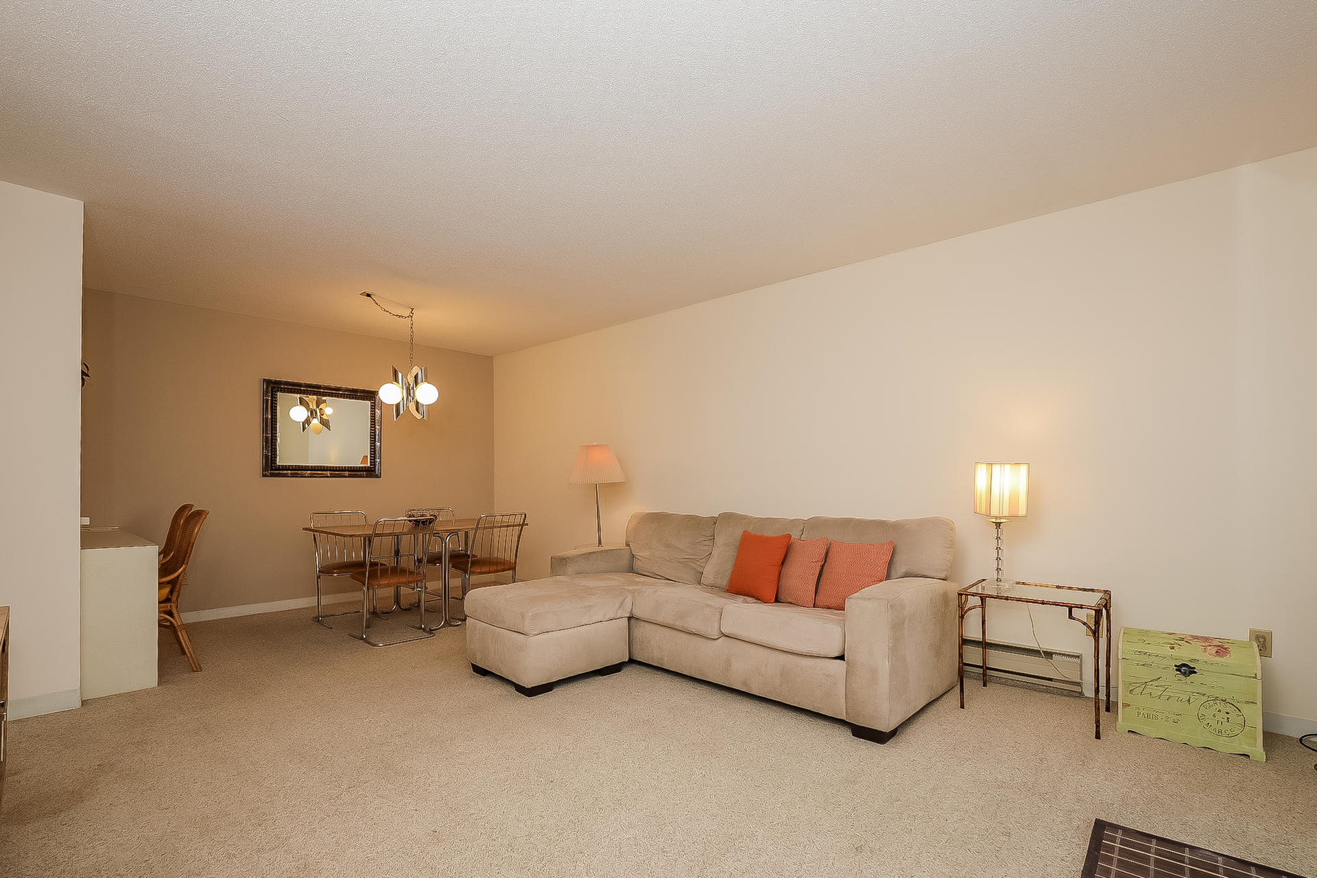 800 Bearses Way, Unit 3EB Hyannis, MA 02601 - Photo 8 of 23 a living room with furniture and a lamp