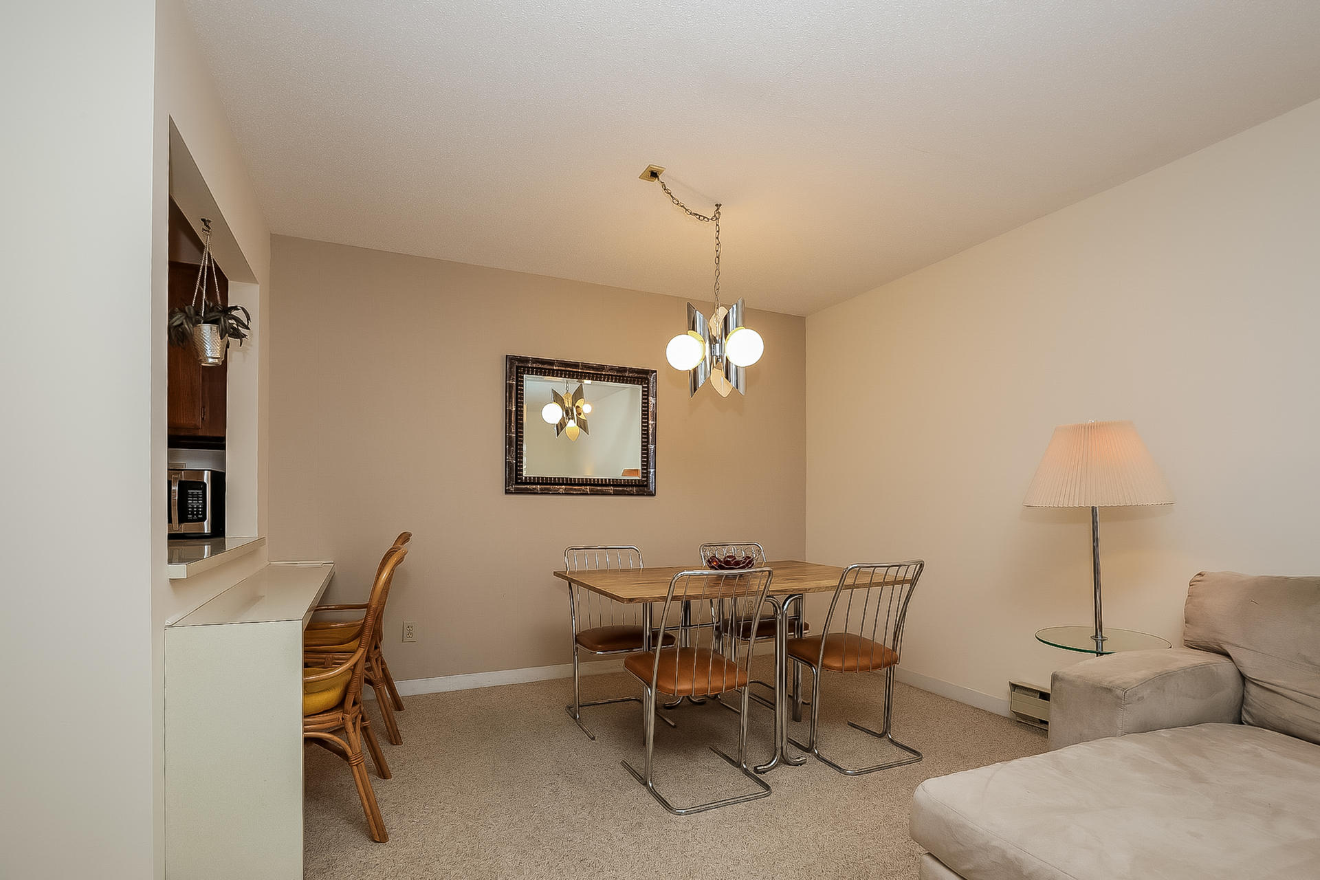 800 Bearses Way, Unit 3EB Hyannis, MA 02601 - Photo 9 of 23 a view of a dining room with furniture and chandelier