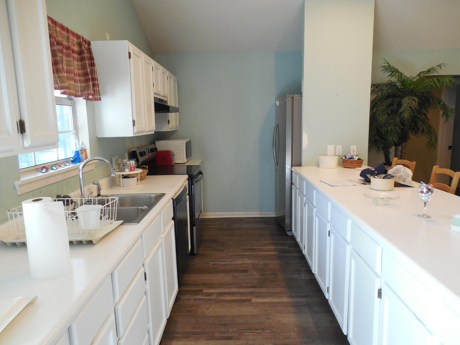 732 Spring Lake Road DeFuniak Springs, FL 32433 - Photo 15 of 44 a kitchen with a sink stove and cabinets
