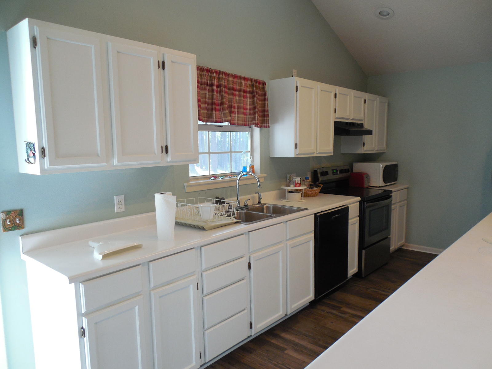 732 Spring Lake Road DeFuniak Springs, FL 32433 - Photo 16 of 44 a kitchen with a sink cabinets and appliances