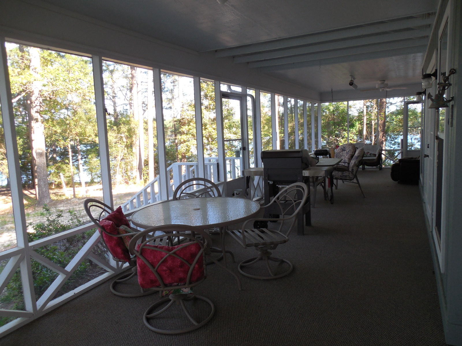 732 Spring Lake Road DeFuniak Springs, FL 32433 - Photo 29 of 44 a dining room with furniture and a floor to ceiling window