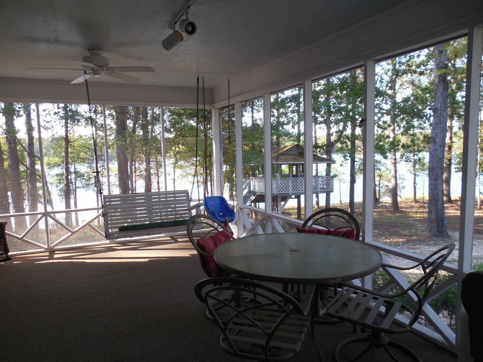 732 Spring Lake Road DeFuniak Springs, FL 32433 - Photo 31 of 44 a view of a dining room with furniture window and outside view