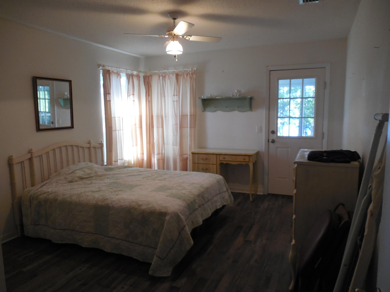 732 Spring Lake Road DeFuniak Springs, FL 32433 - Photo 35 of 44 a bedroom with a bed desk and a window