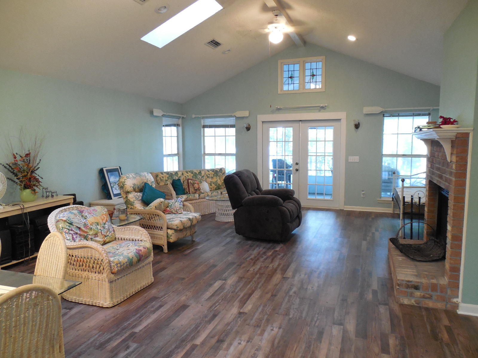 732 Spring Lake Road DeFuniak Springs, FL 32433 - Photo 43 of 44 a living room with fireplace furniture and a wooden floor