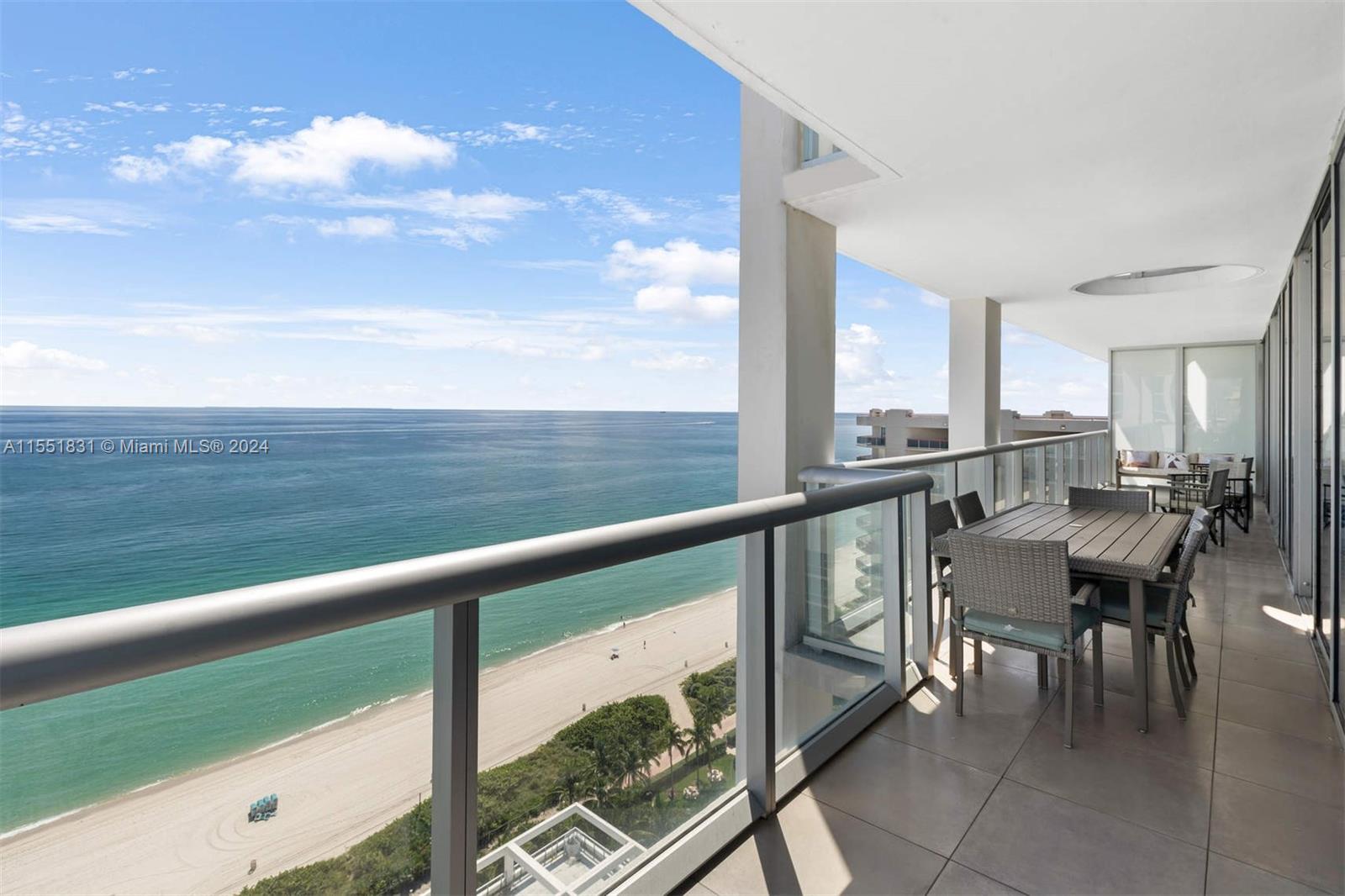 6799 Collins Avenue, Unit LPH2 Miami Beach, FL 33141 - Photo 1 of 1 a view of a chairs and table in the balcony