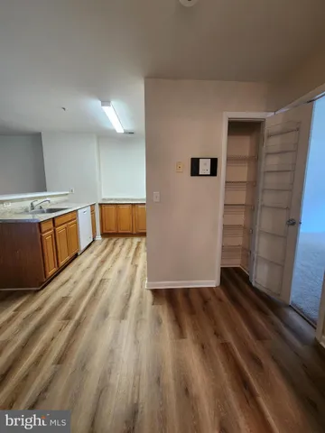 a view of a kitchen with wooden floor