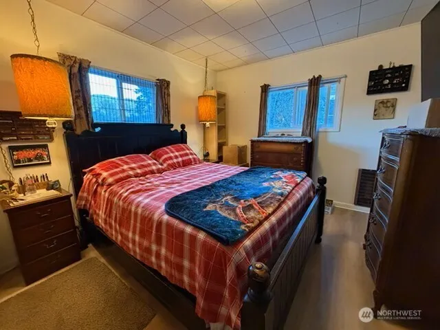 a bedroom with a bed and dresser
