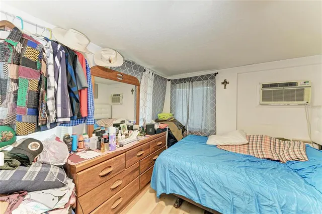 a bedroom with a bed and a table