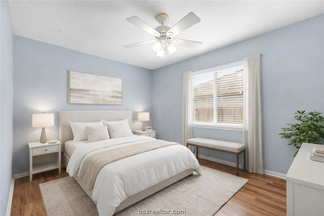 3709 Springfield Drive College Station, TX 77845 - Photo 16 of 23 a bedroom with a large bed and a chandelier