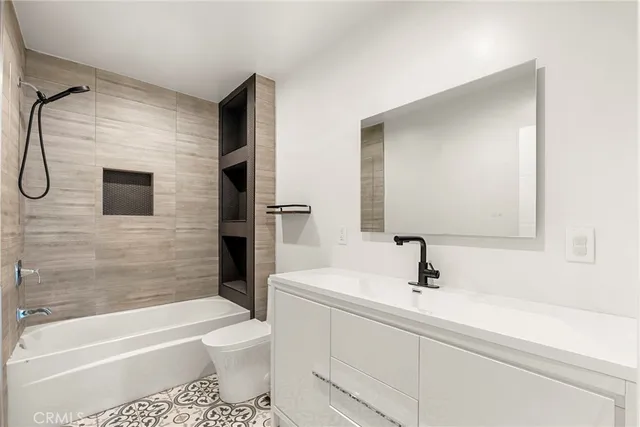 a bathroom with a sink a toilet and a bathtub