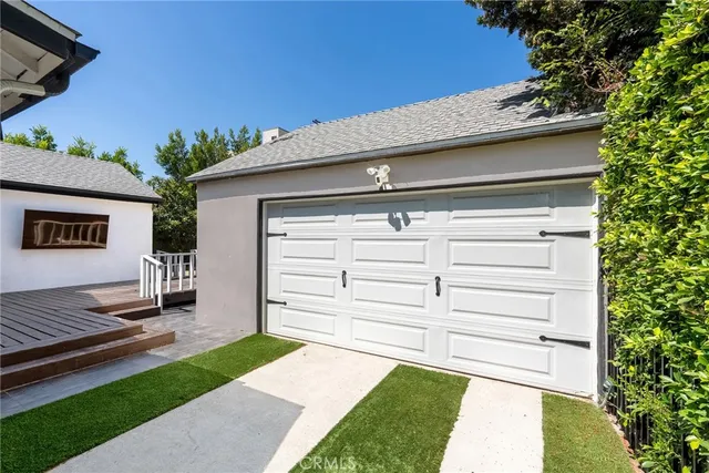 a view of a backyard with a large tree