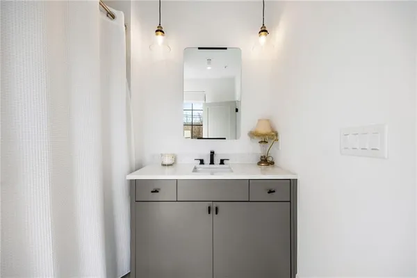 a bathroom with a sink and mirror