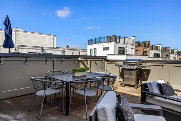 a view of a chairs and table in patio