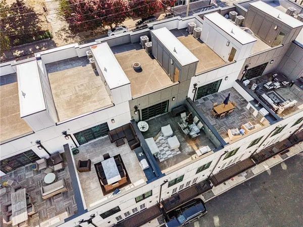 an aerial view of a residential apartment building with a yard