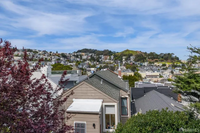 a living room with fireplace furniture and a fireplace