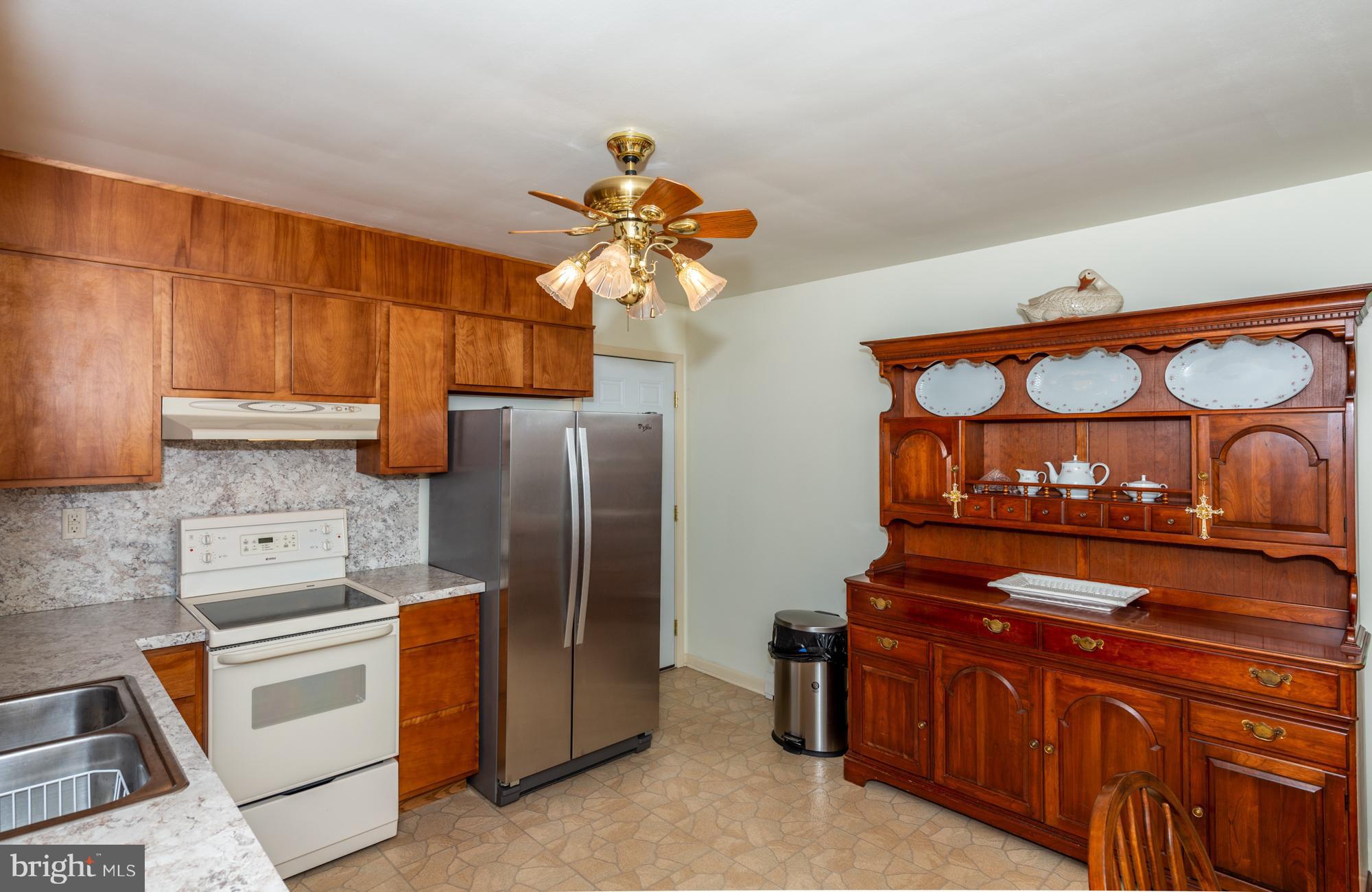 336 School Road Denver, PA 17517 - Photo 11 of 26 a kitchen with stainless steel appliances granite countertop a refrigerator and a stove top oven