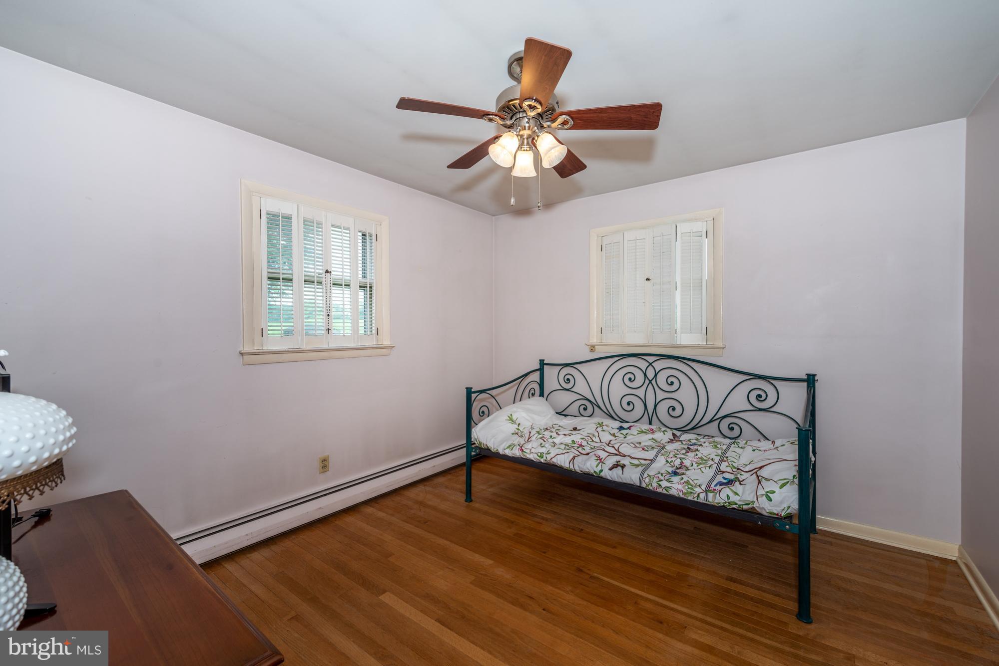 336 School Road Denver, PA 17517 - Photo 16 of 26 a view of an empty room with window and wooden floor