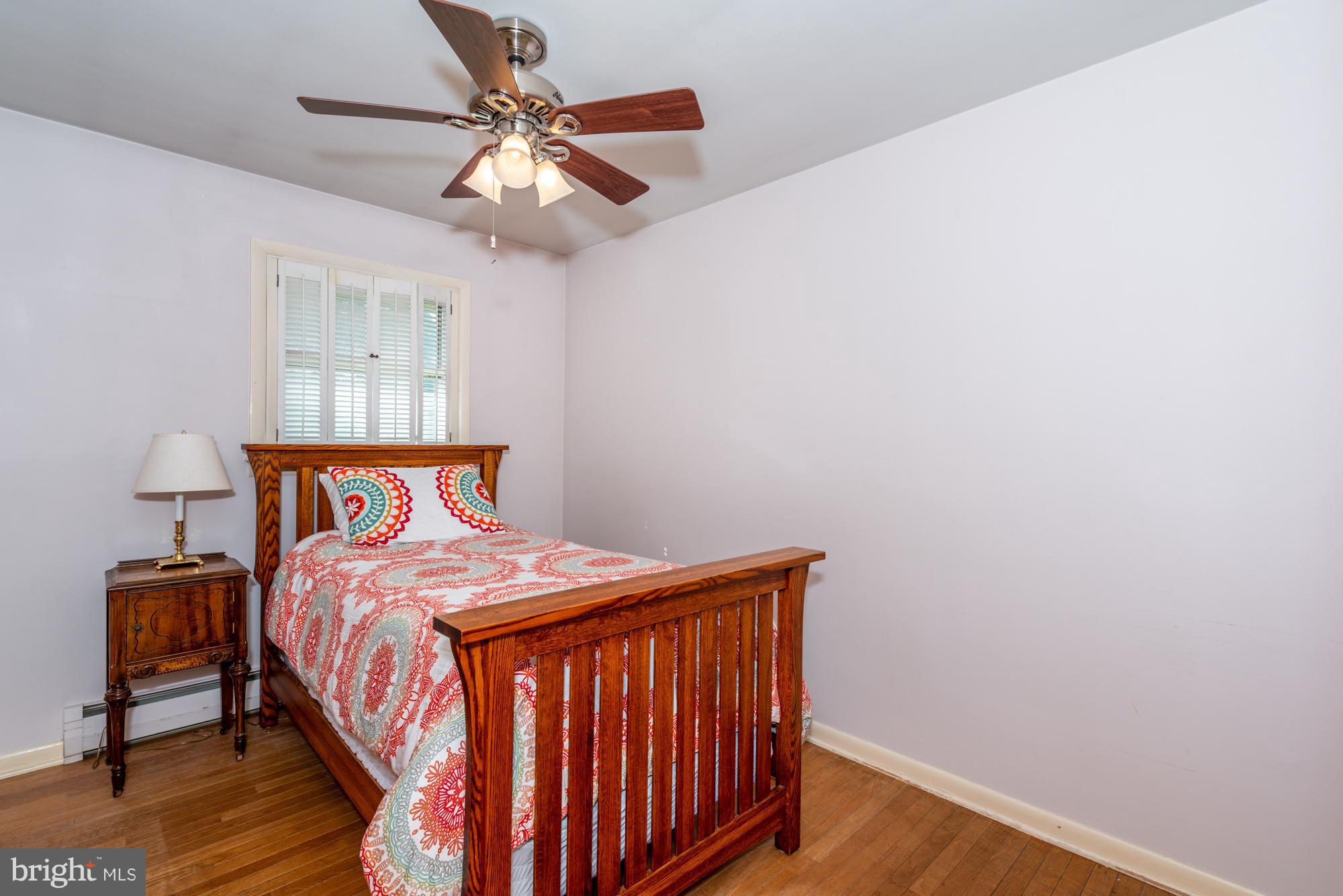 336 School Road Denver, PA 17517 - Photo 17 of 26 a bedroom with a bed and a chandelier