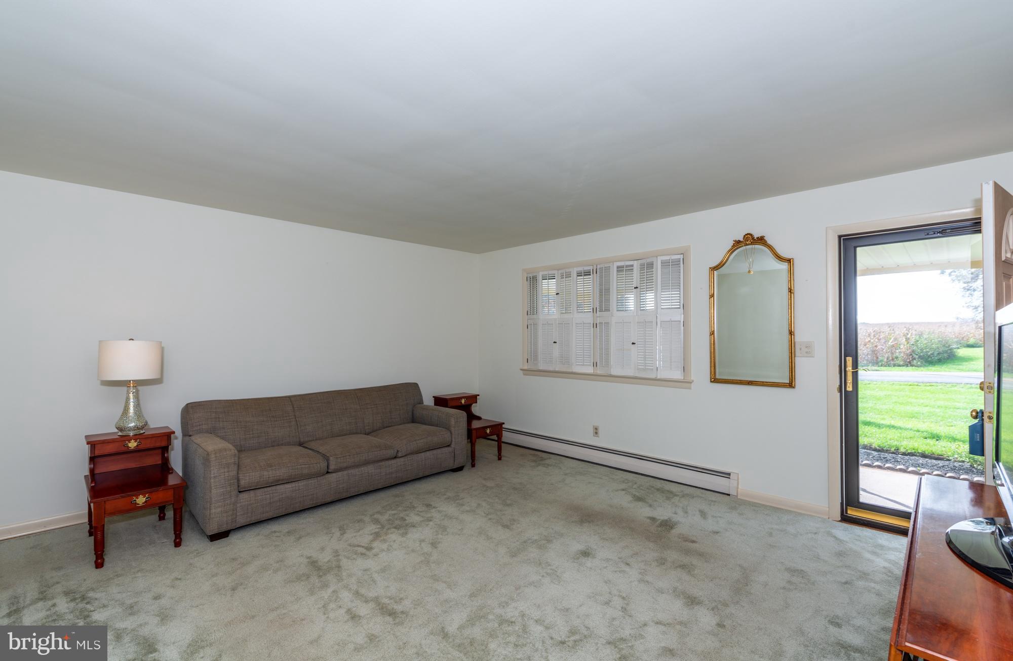 336 School Road Denver, PA 17517 - Photo 5 of 26 a living room with furniture and a window