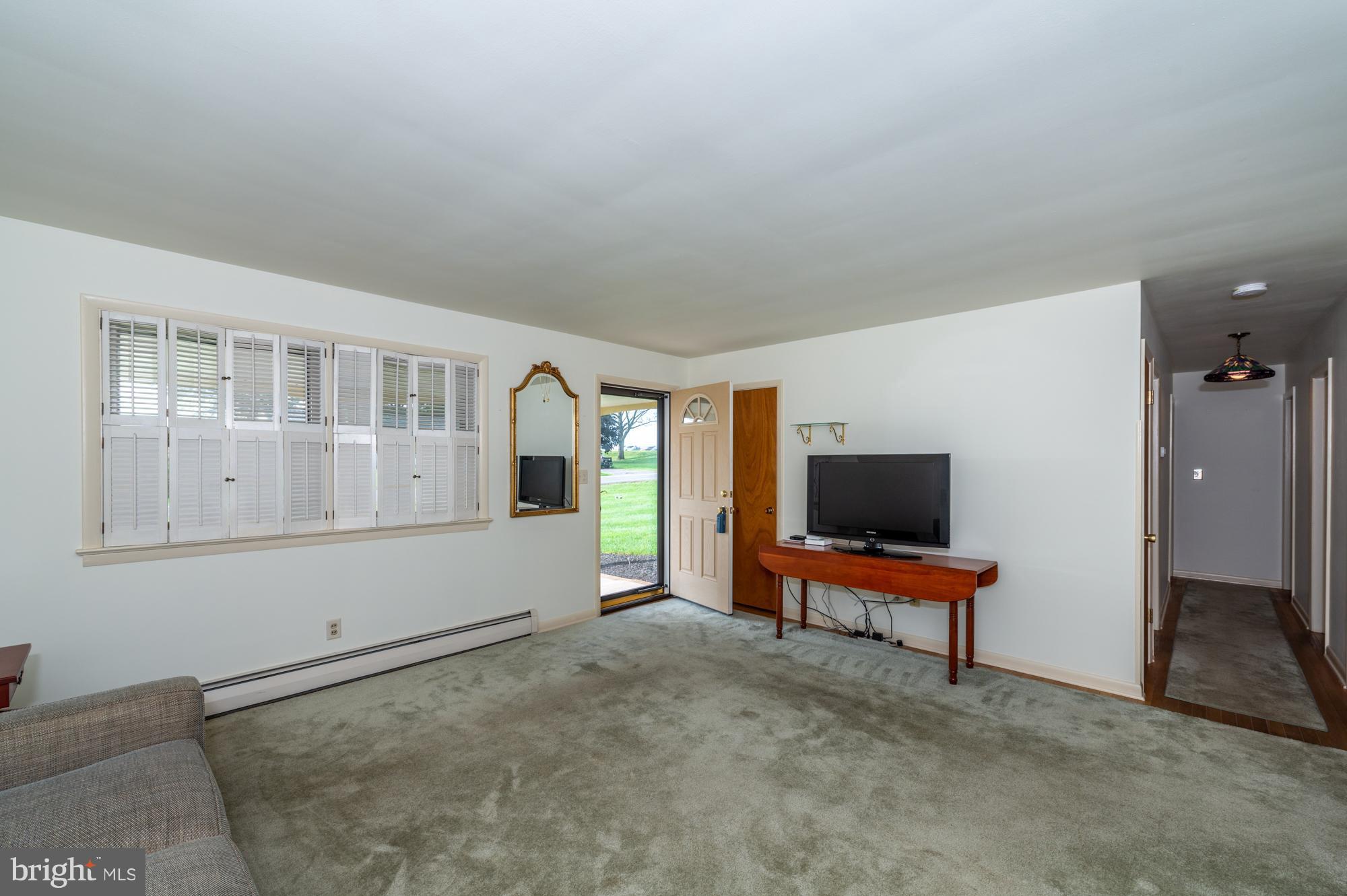 336 School Road Denver, PA 17517 - Photo 6 of 26 a living room with furniture and a flat screen tv