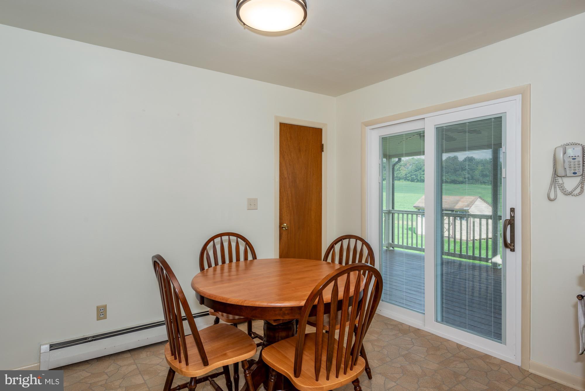336 School Road Denver, PA 17517 - Photo 8 of 26 a view of a dining room with furniture and front door