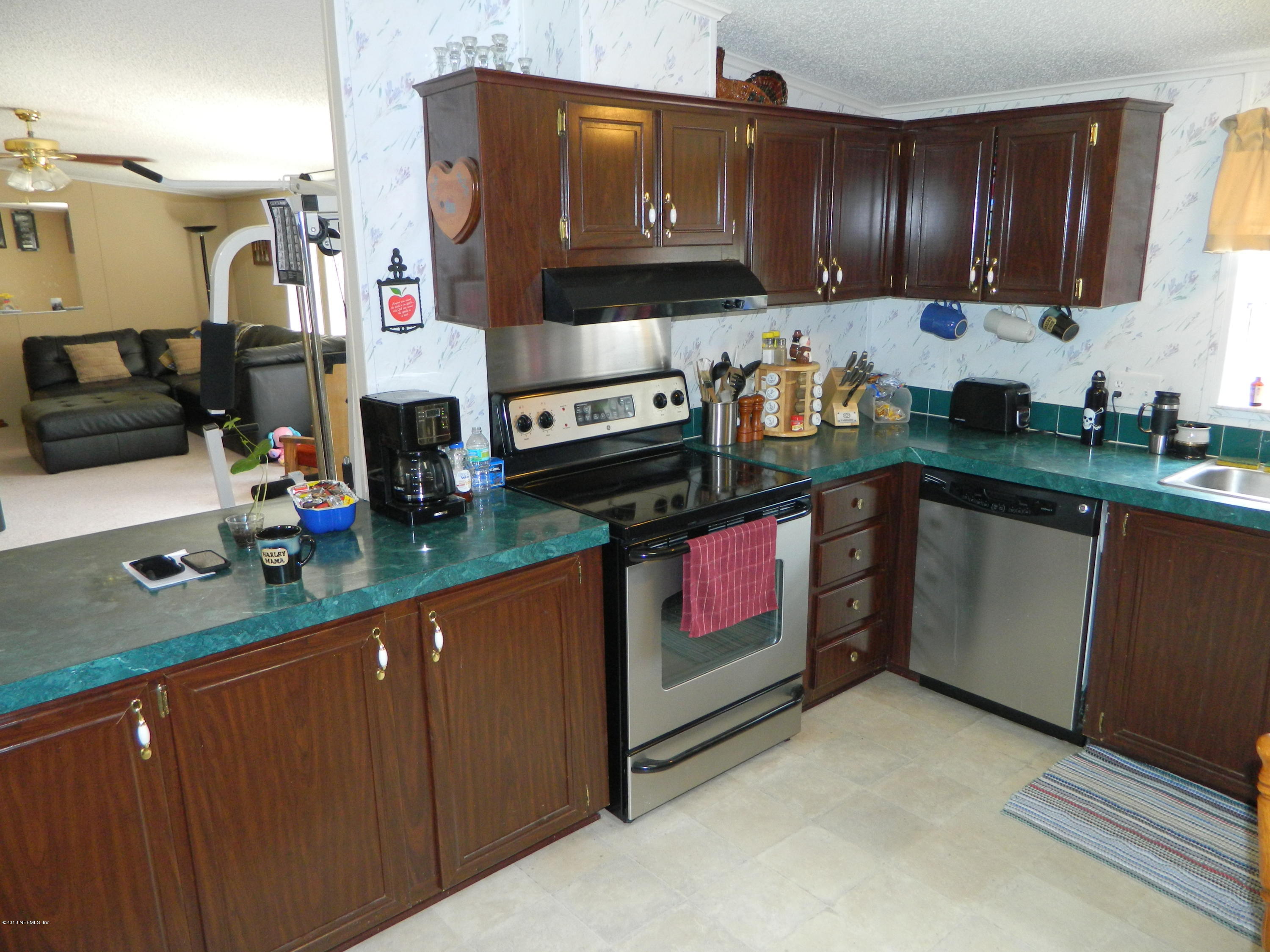 13339 Grover Road Jacksonville, FL 32226 - Photo 12 of 21 Open Kitchen with Bar into Family Room