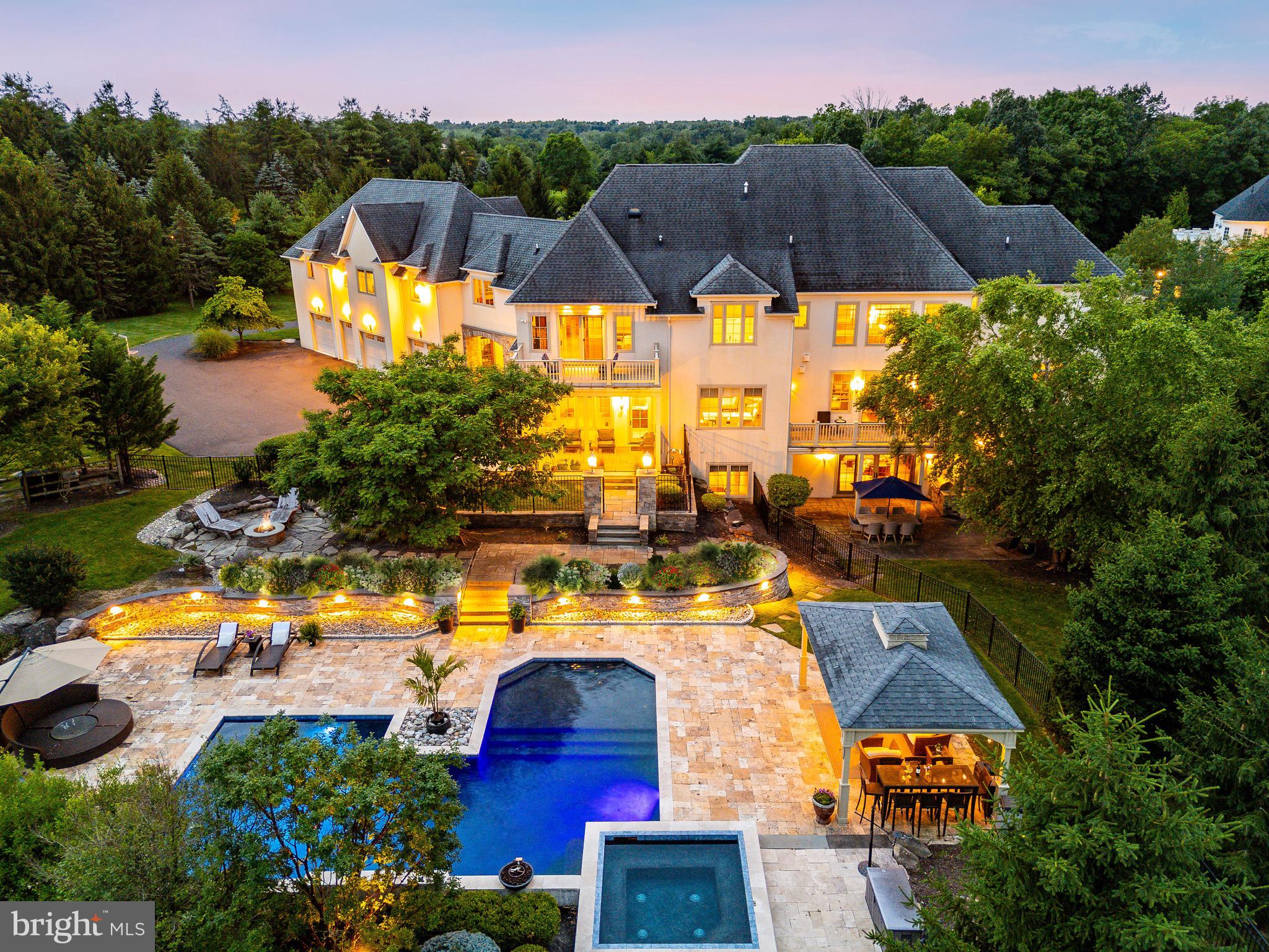 an aerial view of house with yard swimming pool and outdoor seating