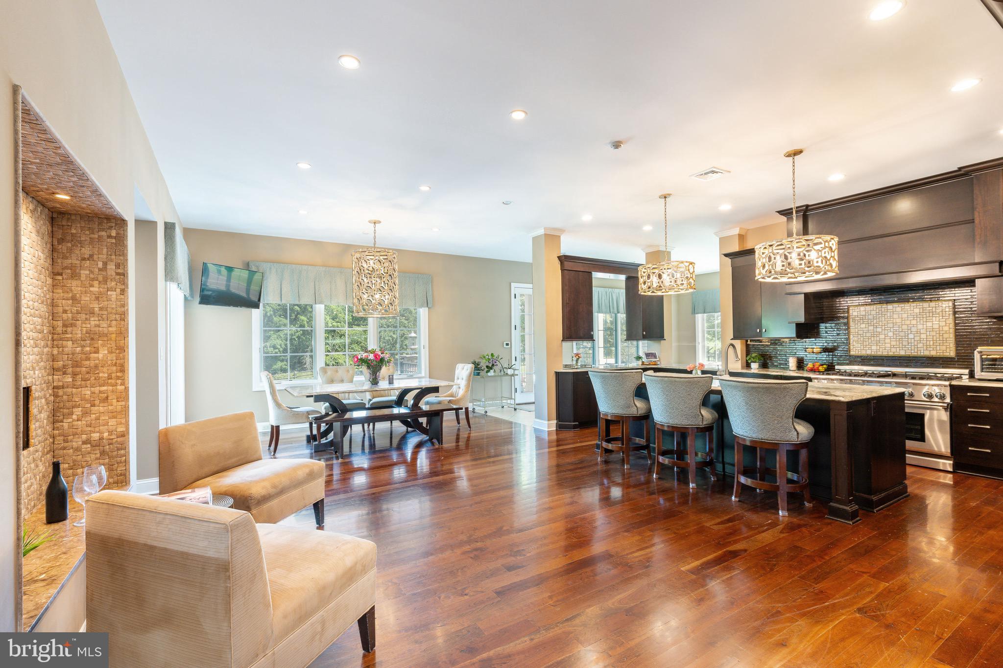 3 Stonebridge Crossing Road Newtown, PA 18940 - Photo 11 of 77 a living room with lots of furniture and kitchen view