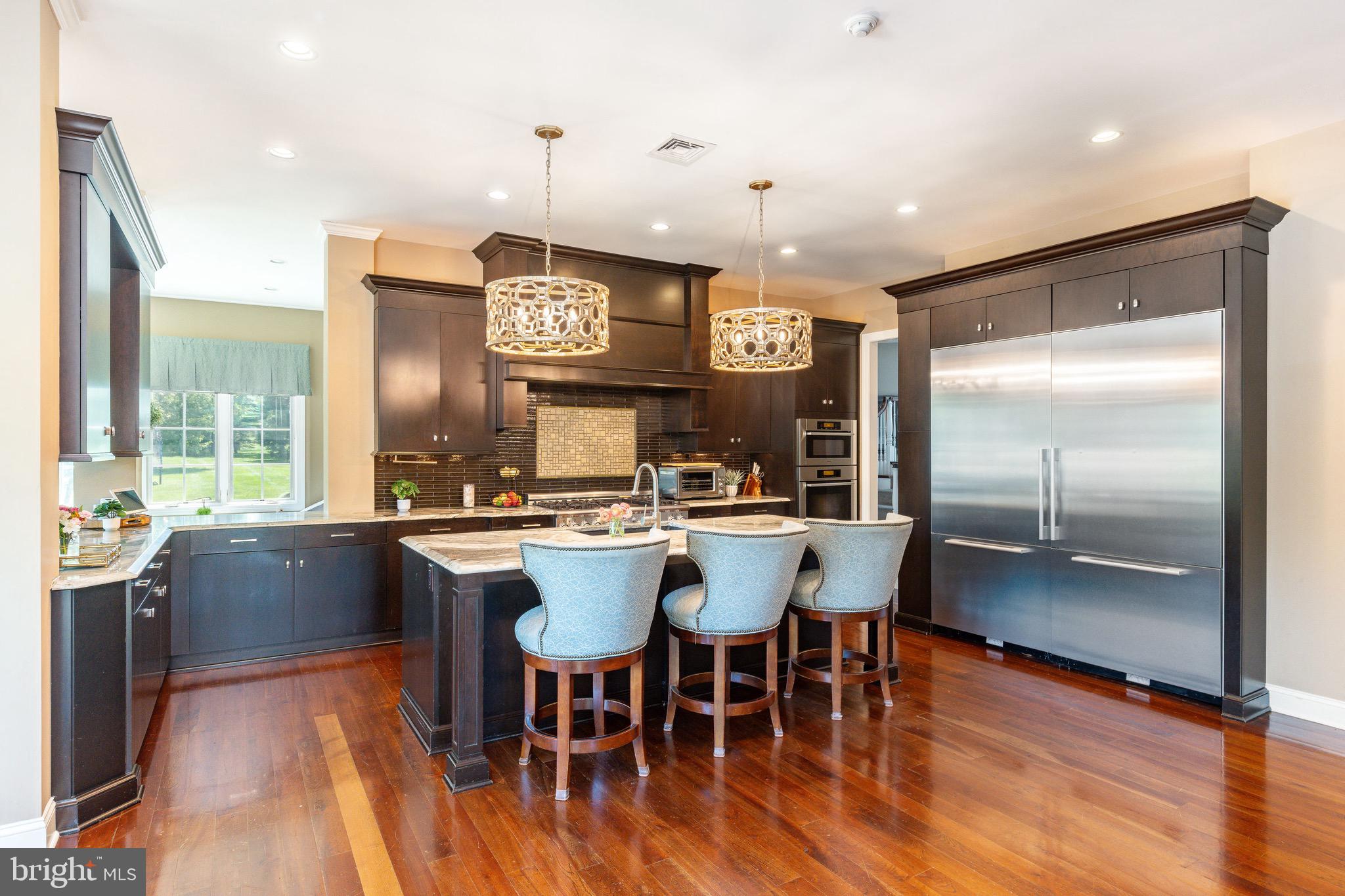3 Stonebridge Crossing Road Newtown, PA 18940 - Photo 12 of 77 a kitchen with a counter space a sink cabinets and stainless steel appliances