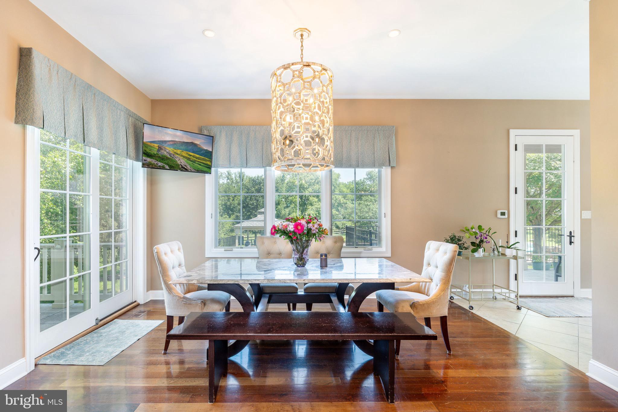 3 Stonebridge Crossing Road Newtown, PA 18940 - Photo 17 of 77 a dining room with furniture wooden floor and a chandelier