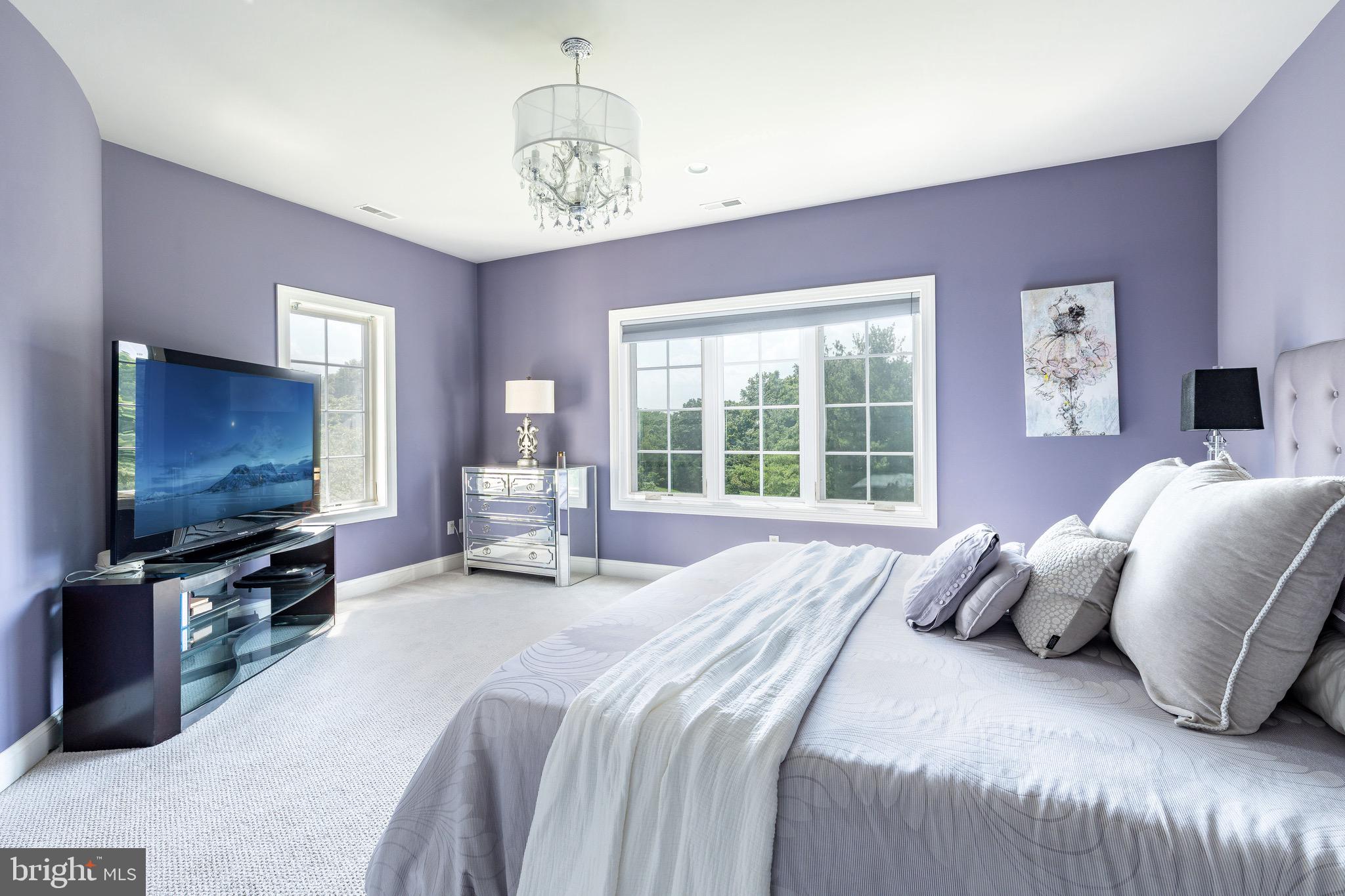 3 Stonebridge Crossing Road Newtown, PA 18940 - Photo 35 of 77 a bedroom with a bed and a flat screen tv