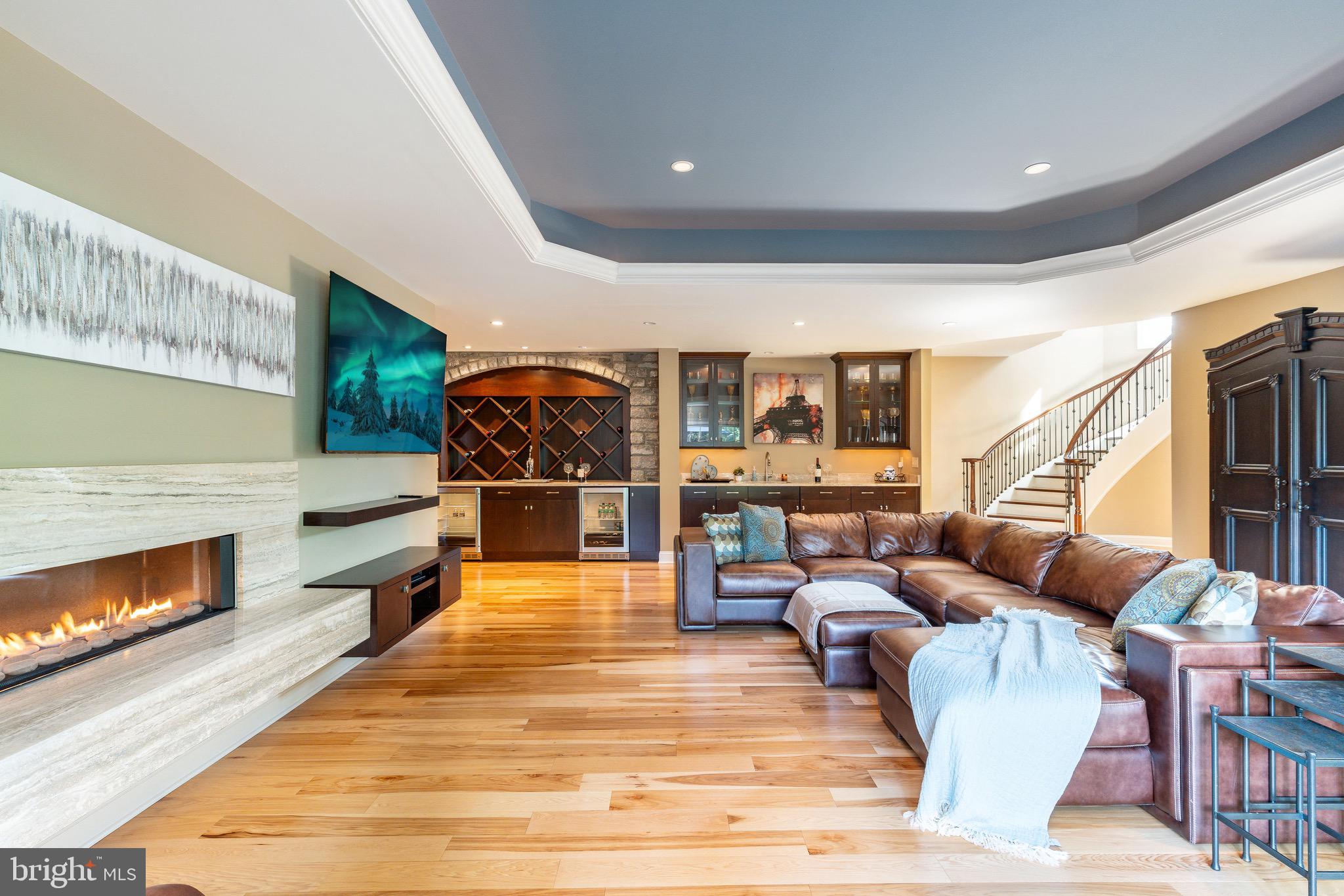 3 Stonebridge Crossing Road Newtown, PA 18940 - Photo 38 of 77 a living room with furniture and a fireplace
