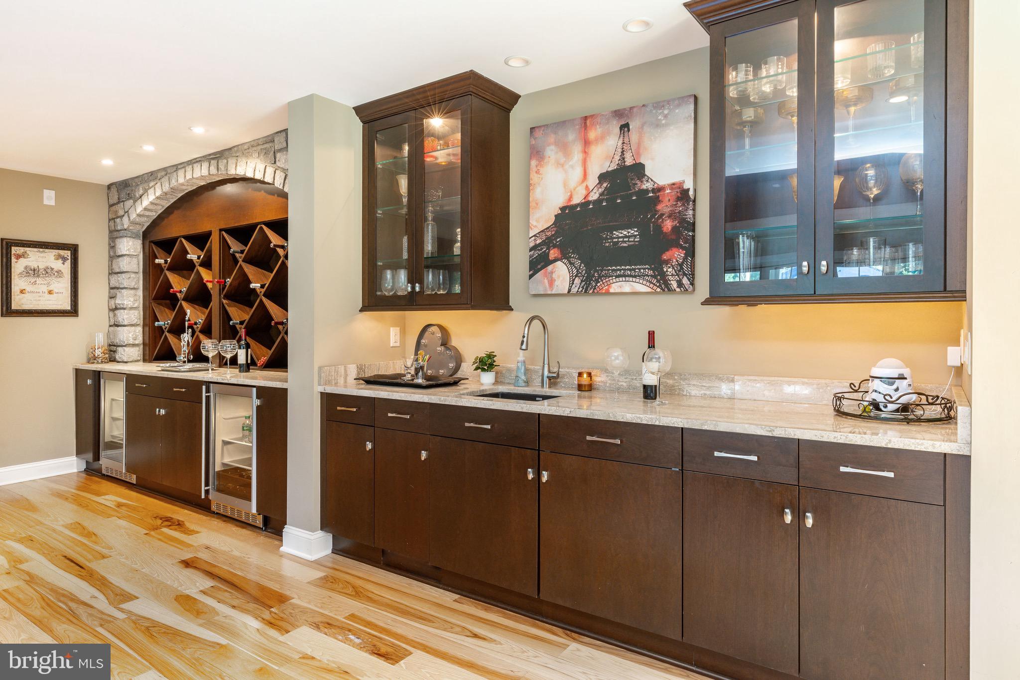 3 Stonebridge Crossing Road Newtown, PA 18940 - Photo 40 of 77 a kitchen with stainless steel appliances granite countertop a sink and wooden cabinets