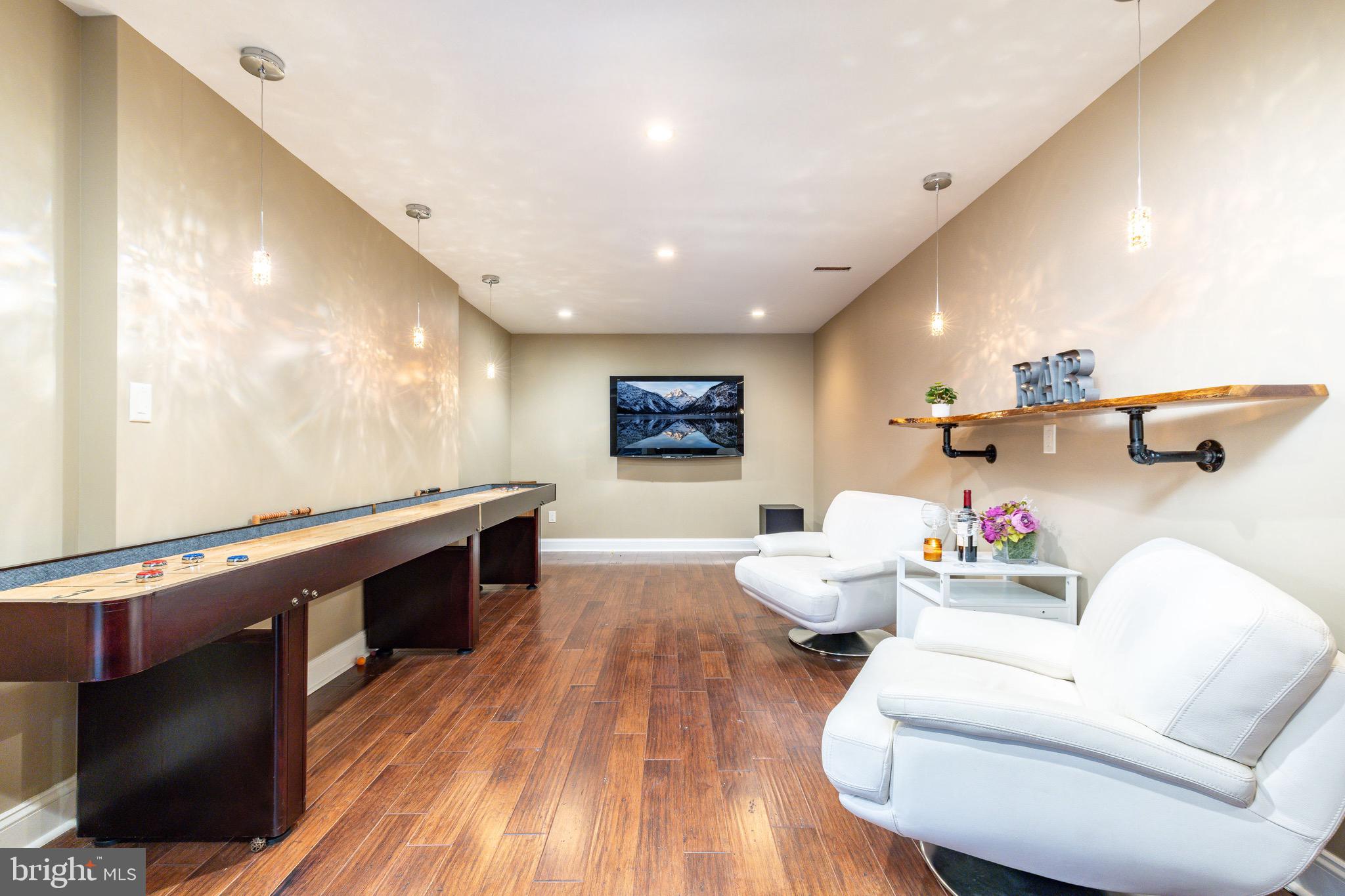 3 Stonebridge Crossing Road Newtown, PA 18940 - Photo 45 of 77 a living room with furniture and a flat screen tv