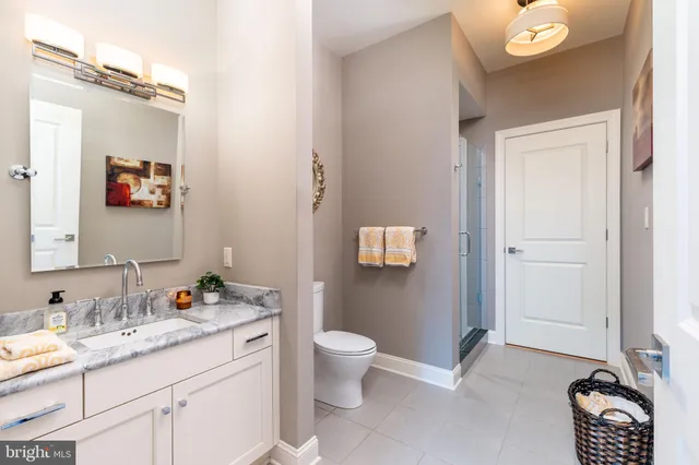 an aerial view of a house with yard green space and outdoor seating
