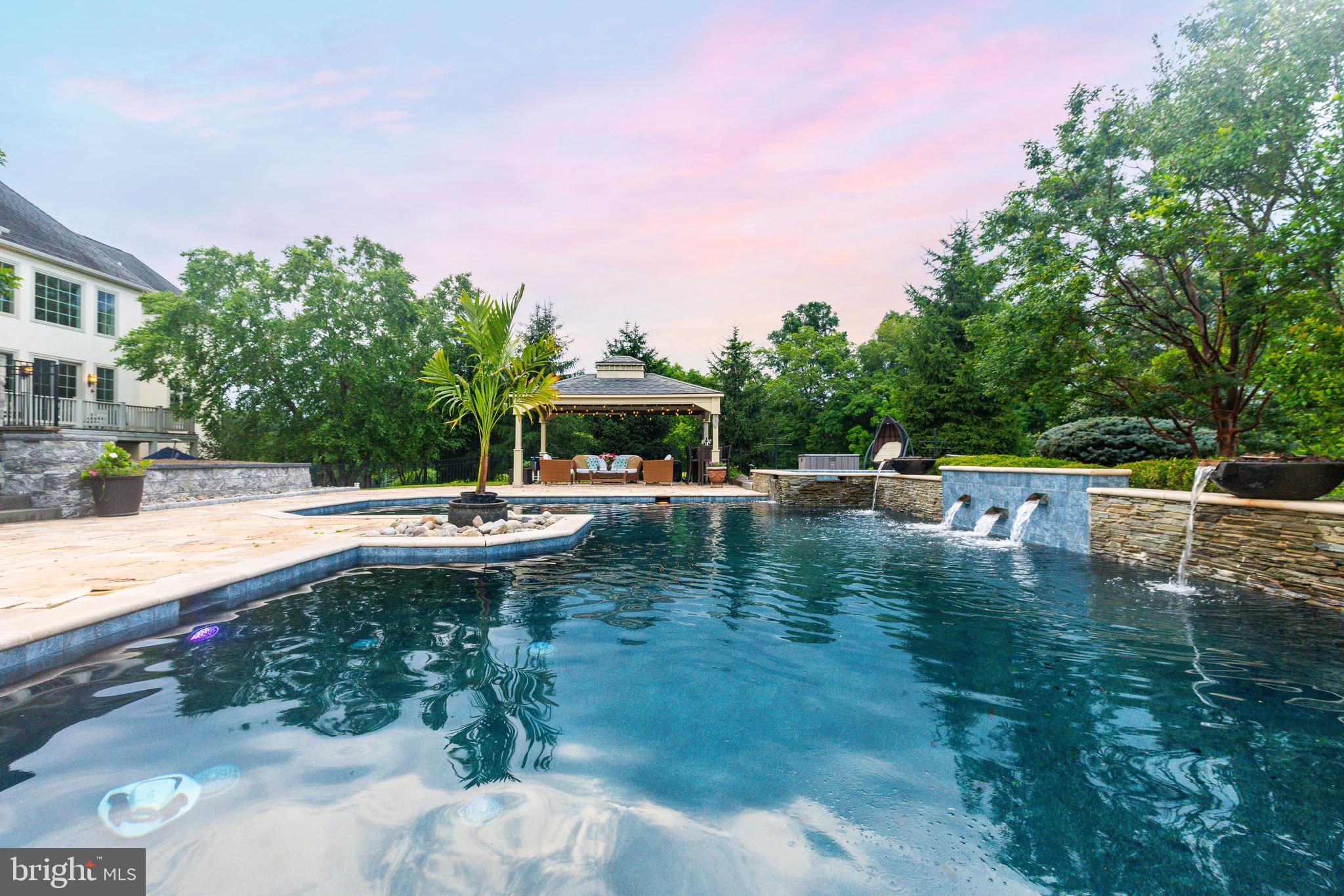 3 Stonebridge Crossing Road Newtown, PA 18940 - Photo 52 of 77 a view of swimming pool with lawn chairs and plants