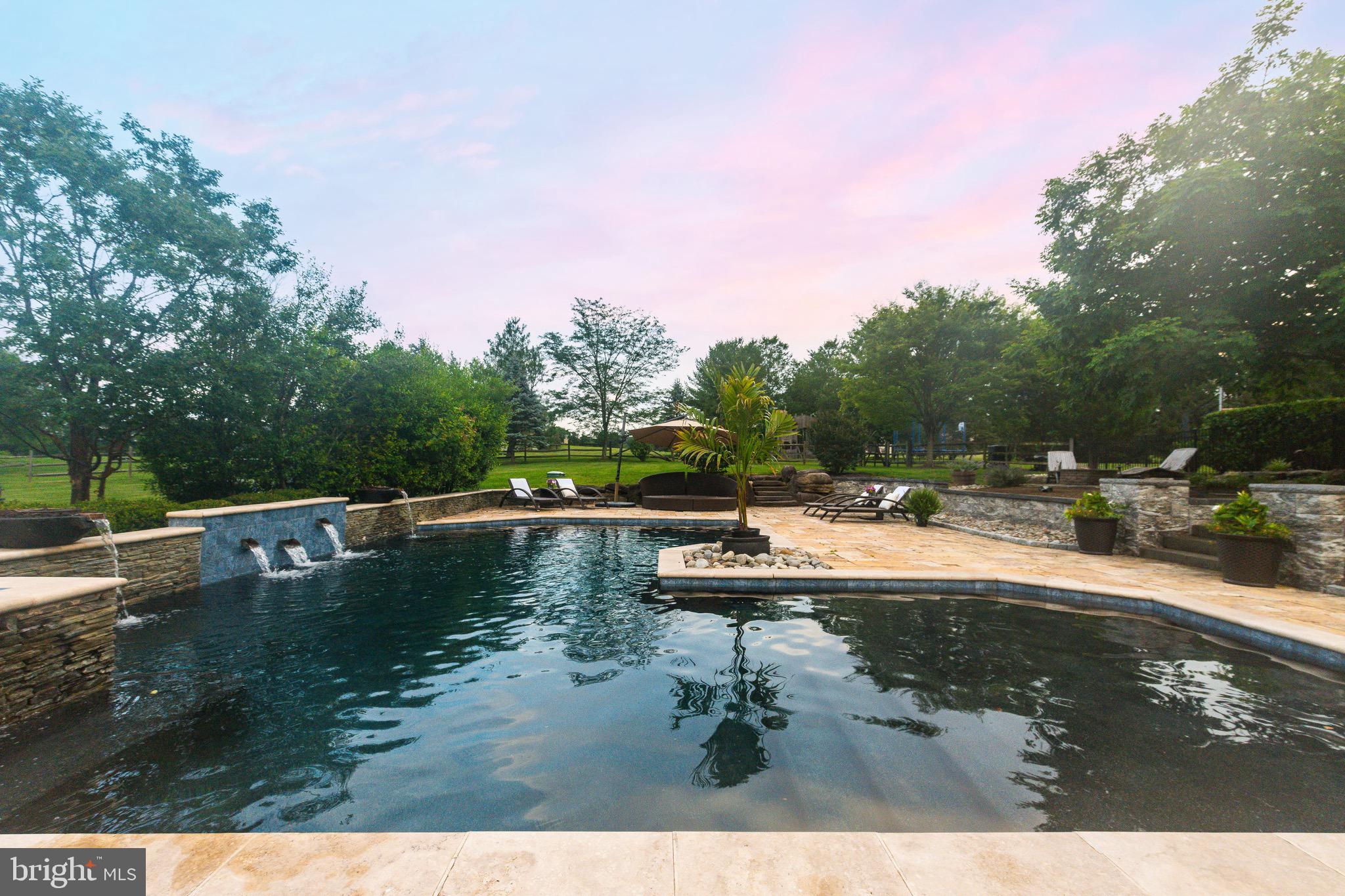 3 Stonebridge Crossing Road Newtown, PA 18940 - Photo 53 of 77 a view of a swimming pool with a yard