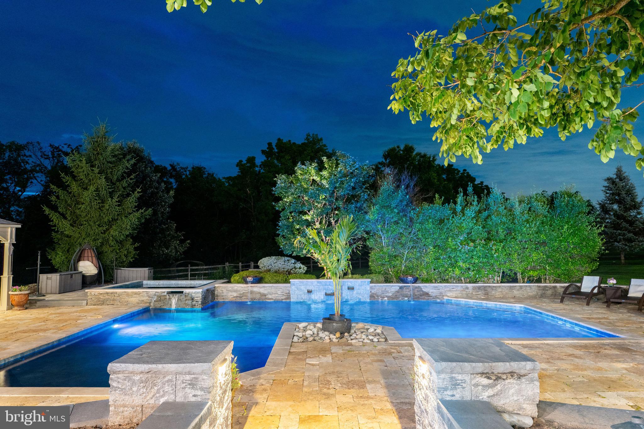 3 Stonebridge Crossing Road Newtown, PA 18940 - Photo 60 of 77 a view of a swimming pool with an outdoor seating
