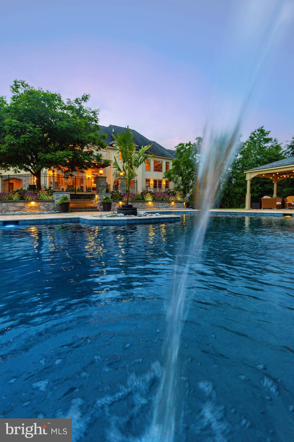 3 Stonebridge Crossing Road Newtown, PA 18940 - Photo 65 of 77 a view of a swimming pool with an outdoor space and seating area