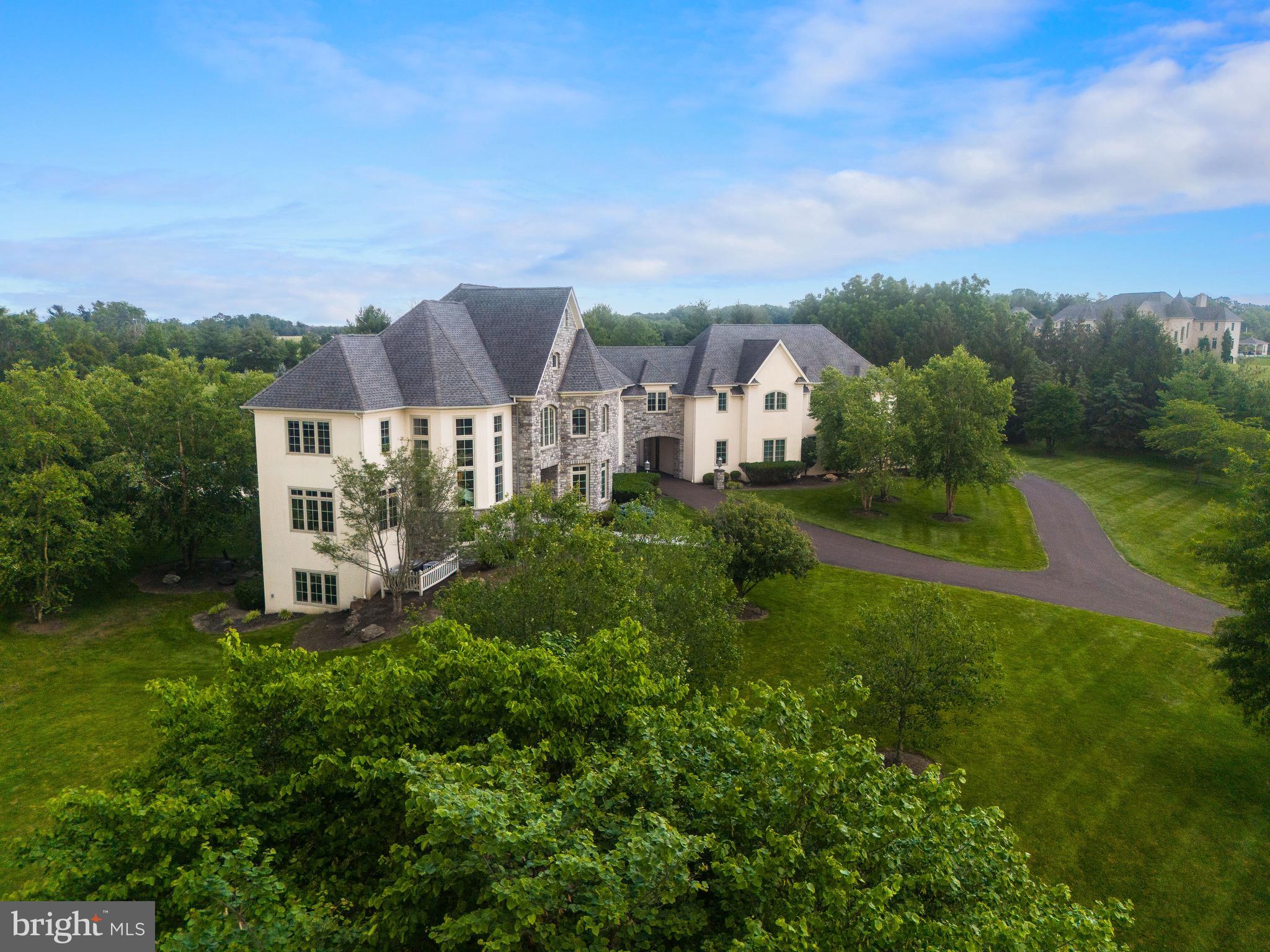 3 Stonebridge Crossing Road Newtown, PA 18940 - Photo 76 of 77 a view of a big house with a big yard plants and large trees